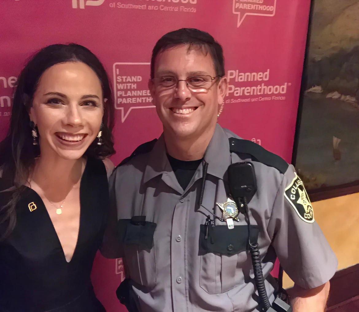 Woman and officer in formal setting